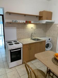 Kuchyň nebo kuchyňský kout v ubytování Apartment Milly