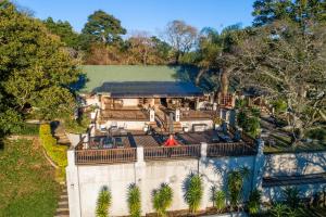 an aerial view of a house with a fence at Chestnut Country Lodge in Hazyview