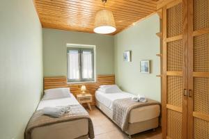 Postel nebo postele na pokoji v ubytování Villa Aurora + 21 fotografií