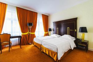 Postel nebo postele na pokoji v ubytování Relais & Châteaux Bülow Palais