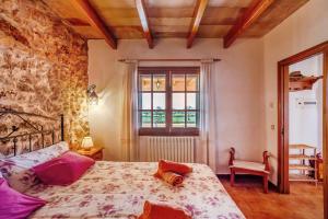 Ένα ή περισσότερα κρεβάτια σε δωμάτιο στο Na Corma by dracmallorca +33 φωτογραφίες