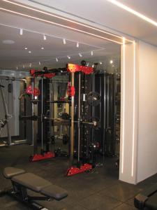a room with a gym with equipment in it at perfect vacation in Eilat - סוויטת בוטיק מעוצבת לחופשה מושלמת באילת במתחם U360 in Eilat