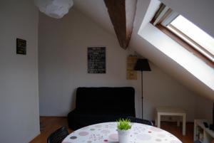 a room with a table and a chair and a window at Freedomus Marne-La-Vallée "Crécy" in Crécy-la-Chapelle