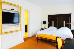 Postel nebo postele na pokoji v ubytování Relais & Châteaux Bülow Palais