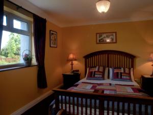 Postel nebo postele na pokoji v ubytování Cappabhaile House