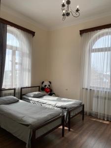 Postel nebo postele na pokoji v ubytování Yan Guest House