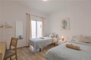Ένα ή περισσότερα κρεβάτια σε δωμάτιο στο TENERIFE URBAN ROOMS