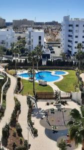 an aerial view of a park with two swimming pools at Costa Blanca Suit in Arenales del Sol