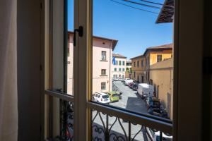 a view of a city street from a window at Casa San Felice in Pisa