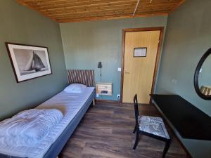 Postel nebo postele na pokoji v ubytování Storstrand Kursgård