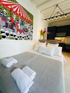 a bedroom with a large bed with two pillows at Memories in Ornos +28 photos