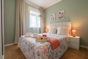 Ένα ή περισσότερα κρεβάτια σε δωμάτιο στο HostWise - Quinta do Vintém w/ Terrace near WOW