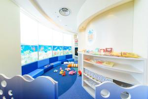 a childs room with blue flooring and blue ceilings at ANA InterContinental Manza Beach Resort by IHG in Onna