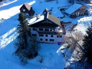 an aerial view of a building in the snow at Le Grand Som - Proche Station de ski in Saint-Pierre-de-Chartreuse +9 photos