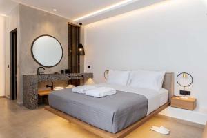 Cama ou camas em um quarto em Avra Mykonos