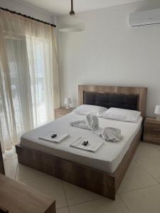a bedroom with a large bed with towels on it at marialena villa in Skala Potamias