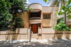 a house with a front door and a porch at Jeraisyl-Family-3 Spacious AC Bedroom Luxurious Peaceful Bungalow in Bengaluru