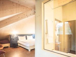 Postel nebo postele na pokoji v ubytování Lodge Hof Weissbad