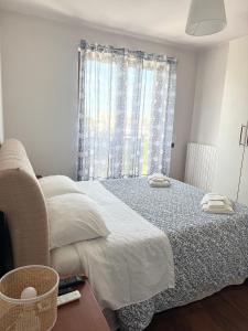 a bedroom with a bed and a window at HomeAway Pescara Airport in San Giovanni Teatino