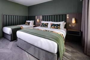 Ένα ή περισσότερα κρεβάτια σε δωμάτιο στο Hotel Killarney