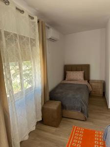 Postel nebo postele na pokoji v ubytování Vila Zefi