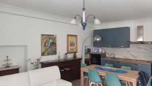 a kitchen and dining room with a table and chairs at MARCELLA Appartamento Full-optional in Centro Storico in Tropea +40 photos