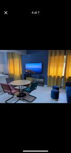 a room with a table and chairs and a table and chairs at Luxro Home Crotone in Crotone
