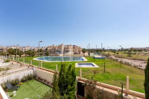 a view of a park with a swimming pool at Campo de golf, piscina y padel in Almería