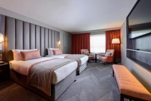 Ένα ή περισσότερα κρεβάτια σε δωμάτιο στο Hotel Killarney