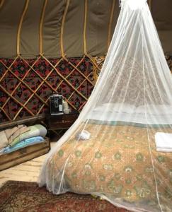 Postel nebo postele na pokoji v ubytování GLAMPING RETREAT i LAGHETTI