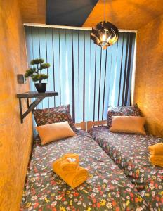 two beds sitting next to each other in a room at Cicha przystań in Świerklany +11 photos