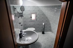 a bathroom with a sink and a toilet at Caravigna Love in Carovigno