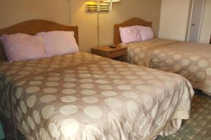 Postel nebo postele na pokoji v ubytování Interstate Motel + 9 fotografií