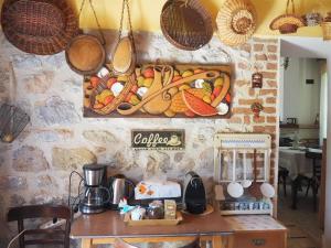 a display of vegetables on a wall in a kitchen at Paliouri House in Paliouri