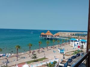 a view of a beach with a pier at Miramar in M'diq