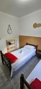 a bedroom with two beds in a room at Refúgio do Coração in Bueno Brandão