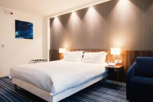 Postel nebo postele na pokoji v ubytování Holiday Inn Express Lille Centre by IHG