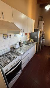 Kuchyň nebo kuchyňský kout v ubytování Casa en potrerillos