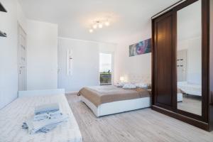 Postel nebo postele na pokoji v ubytování Aleksandra