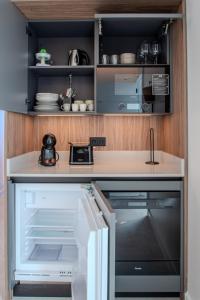 Kuchyň nebo kuchyňský kout v ubytování Sea Breeze Suites