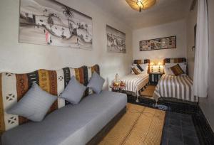 Postel nebo postele na pokoji v ubytování Riad Casa Felicità & SPA