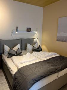 Voodi või voodid majutusasutuse Strandliebe-I-mit-Balkon toas +25 fotot