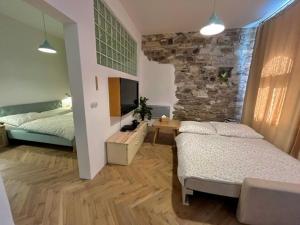 Postel nebo postele na pokoji v ubytování Apartmány Naxarův dvůr + 37 fotografií