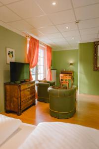 TV a/nebo společenská místnost v ubytování Hotel Stadtresidenz