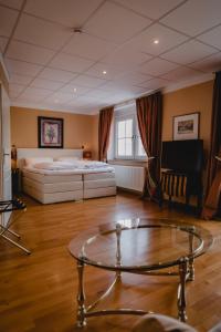 Postel nebo postele na pokoji v ubytování Hotel Stadtresidenz