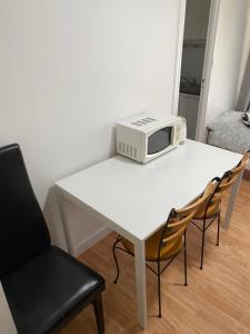 Posezení v ubytování Studio cosy en plein cœur de Paris