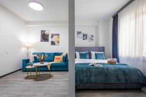 a bedroom with a blue bed and a blue couch at Апарт-отель MICH8 by KEYGO in Yerevan