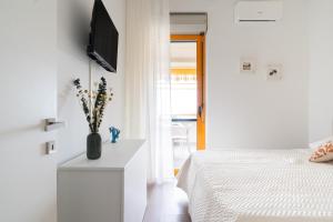 En eller flere senge i et værelse på Casa Levante by Wonderful Italy + 29 billeder