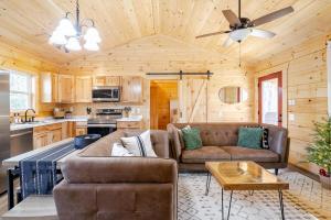 a living room with a couch and a table at Cozy Cabin Getaway! in Fancy Gap