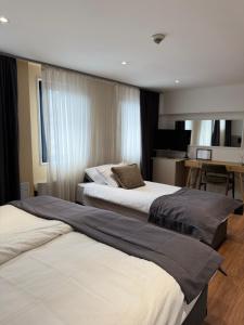 Letto o letti in una camera di Hotel Astra